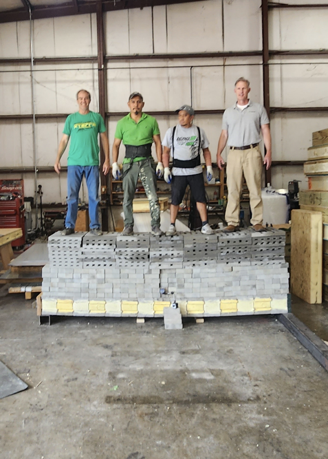 116 inch wall suspended on its side withstanding the weight of 4 men and lots of bricks - approx 400 lb/sq in.