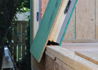 Eco-Panel wall panel sitting on base plate and overlapping the rim for extra support.