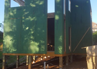 Siding laps over both lower and upper level floor panels, providing better strength and insulation.